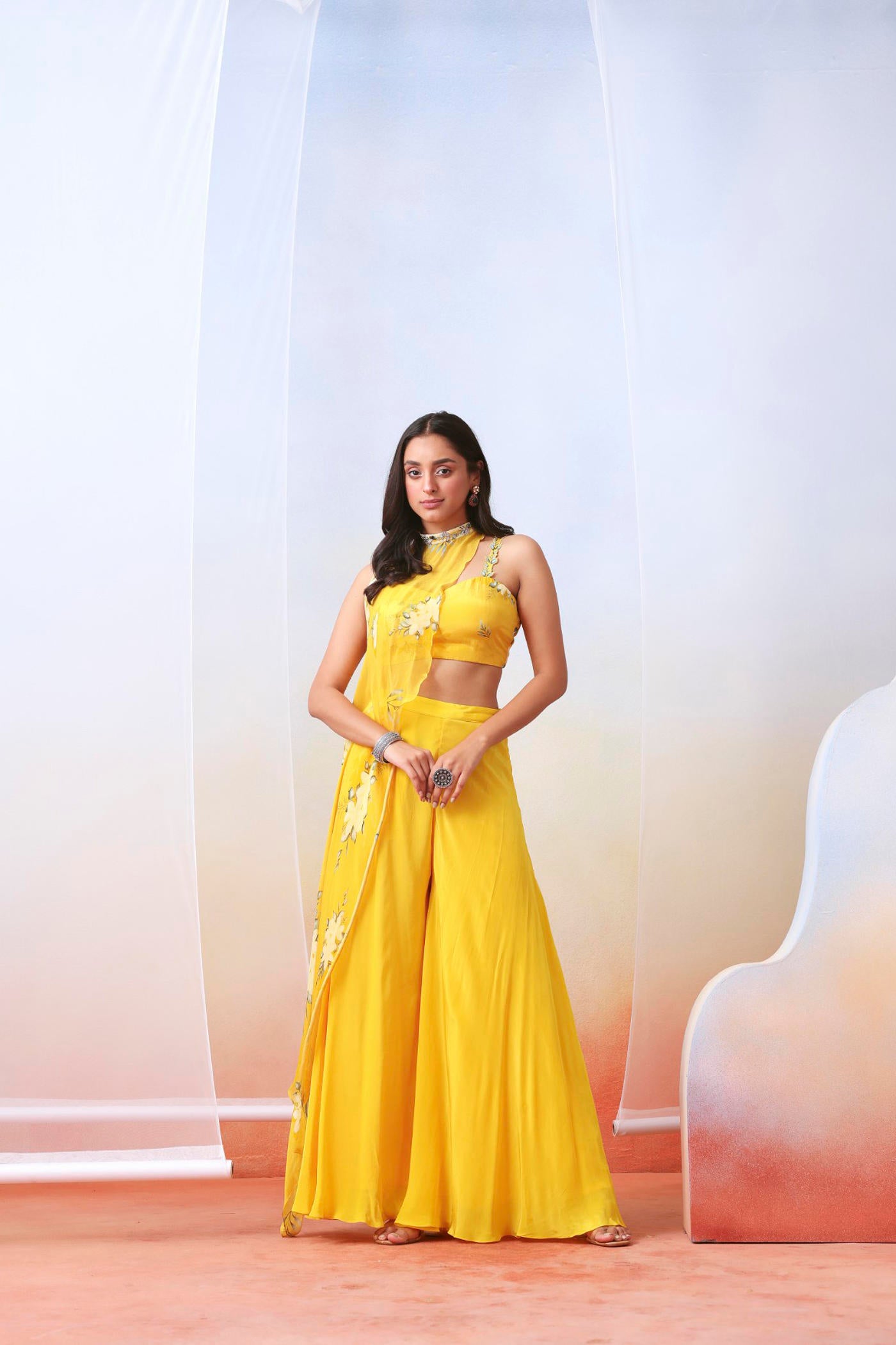 Yellow printed sharara set with embroidered drape cape